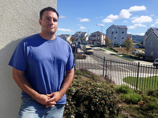 Richmond Police Officer Benjamin Therriault stands outside of his apartment in Richmond Village. (Photo by Shawn Baldwin)